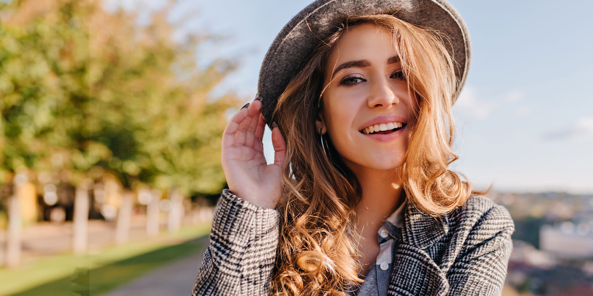 girl after smile makeover with pretty hat