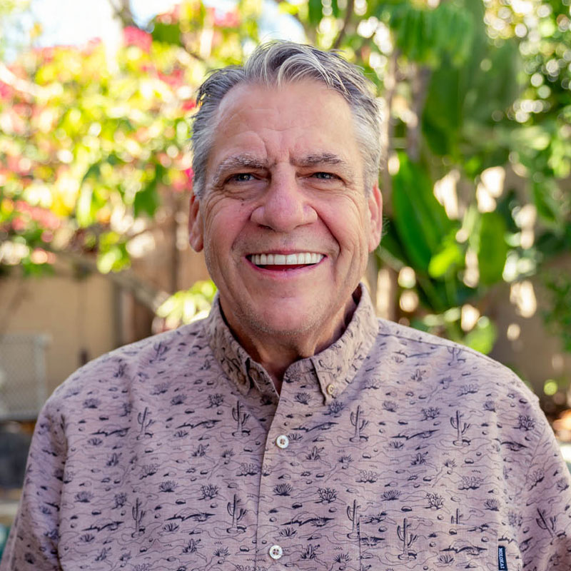 man with cactus collared shirt nice smile