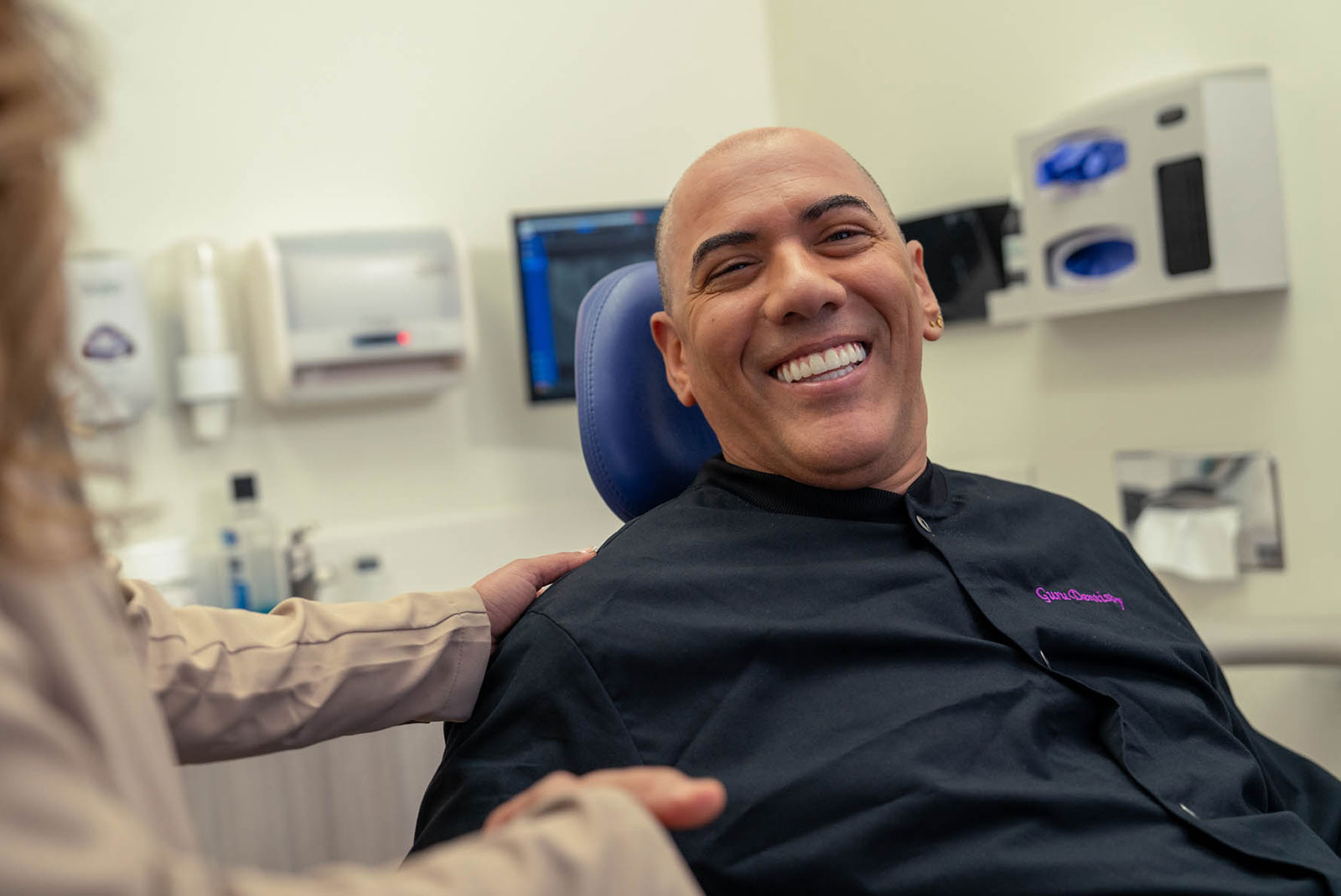 smiling man talking to dr godara